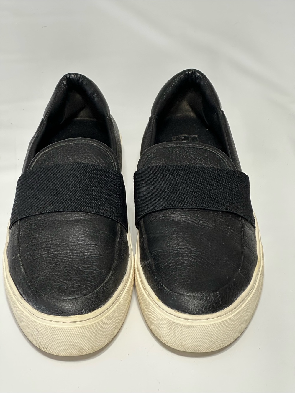 UGG Women’s Slip-On Leather Shies  in Black with White  Sole